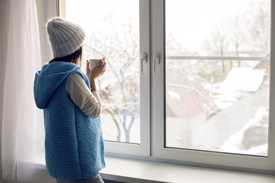 girl in a white hat and blue vest