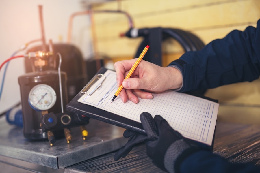 HVAC tech with a clipboard